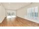 Spacious living room with large windows and hardwood floors, illuminated by natural light at 17563 Hawks View Dr, Fort Mill, SC 29707