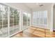 Sunroom featuring hardwood floors, and large sliding windows to the outside deck at 17563 Hawks View Dr, Fort Mill, SC 29707