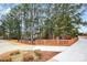 Scenic walking path with wooden railings winding through a lush, wooded area at 17563 Hawks View Dr, Fort Mill, SC 29707