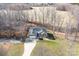 Aerial view of a well-maintained home with a large yard backing to fields and wooded area at 1790 Kathy St, Newton, NC 28658