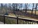 The wooden back deck of the home offering beautiful views of the surrounding wooded landscape and yard at 1790 Kathy St, Newton, NC 28658