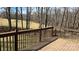 A wooden back deck overlooks the wooded backyard, offering a peaceful and private outdoor living space at 1790 Kathy St, Newton, NC 28658