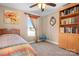 Bright bedroom with a cozy bed, side table, bookshelf, and a sunlit window at 1790 Kathy St, Newton, NC 28658