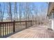 Relax on the wooden deck and enjoy peaceful outdoor views in this home's backyard at 1790 Kathy St, Newton, NC 28658