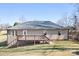 Back exterior view of home with a cozy deck, perfect for outdoor entertainment at 1790 Kathy St, Newton, NC 28658