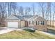 Beautiful home with brick and siding exterior, featuring a two-car garage and covered front entry at 1790 Kathy St, Newton, NC 28658