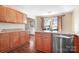 Kitchen featuring wooden cabinets, granite countertops, stainless steel dishwasher, and island with seating at 1790 Kathy St, Newton, NC 28658