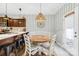 Bright breakfast nook area featuring a round table, seating for four, and pendant lighting at 191 Sutters Mill Dr, Troutman, NC 28166