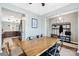 Stylish dining room with hardwood floors, a view into the kitchen, and modern decor at 191 Sutters Mill Dr, Troutman, NC 28166