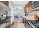 Open kitchen area showcasing stainless steel appliances and views into dining area at 191 Sutters Mill Dr, Troutman, NC 28166