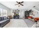 Inviting living room featuring an entertainment center, a ceiling fan, and comfortable seating at 191 Sutters Mill Dr, Troutman, NC 28166