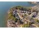 Aerial view of lakefront homes and surrounding landscape at 220 Ambleside Village Ln, Davidson, NC 28036