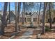 Stone path through trees to the house at 220 Ambleside Village Ln, Davidson, NC 28036