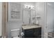 Bathroom with dark vanity, granite countertop, and a walk-in shower at 220 Ambleside Village Ln, Davidson, NC 28036