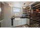 Basement wet bar with wine cooler and sink at 2240 Mecklenburg Ave, Charlotte, NC 28205