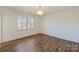 Well-lit bedroom with hardwood floors and plantation shutters at 2240 Mecklenburg Ave, Charlotte, NC 28205