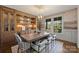 Elegant dining room featuring a built-in buffet and large windows at 2240 Mecklenburg Ave, Charlotte, NC 28205