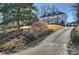 Long driveway leading to a charming two-story house at 2240 Mecklenburg Ave, Charlotte, NC 28205