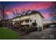 Two-story white house with a driveway and manicured lawn at 2240 Mecklenburg Ave, Charlotte, NC 28205