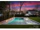 Modern rectangular pool with a spa and surrounding landscaping at 2240 Mecklenburg Ave, Charlotte, NC 28205