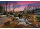 Serene pond with a waterfall and lush landscaping at 2240 Mecklenburg Ave, Charlotte, NC 28205