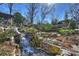 Serene waterfall feature in the backyard at 2240 Mecklenburg Ave, Charlotte, NC 28205