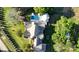 An aerial view of a property showcasing a pool, outdoor kitchen, fire pit, and beautifully landscaped yard at 2270 New Gray Rock Rd, Fort Mill, SC 29708