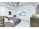 Spacious bedroom featuring vaulted ceiling, ceiling fan, horse art, comfy chair and lots of natural light at 2270 New Gray Rock Rd, Fort Mill, SC 29708