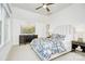 Bright bedroom featuring patterned bedding, modern furniture, neutral walls, and light colored carpet at 2270 New Gray Rock Rd, Fort Mill, SC 29708