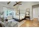 Bright bedroom with a bed, mirror, ceiling fan, and hardwood floors at 2270 New Gray Rock Rd, Fort Mill, SC 29708