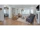 Cozy living room featuring hardwood floors, a fireplace, and ample natural light from large windows at 2270 New Gray Rock Rd, Fort Mill, SC 29708