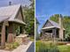 A well designed pool house with outdoor kitchen, bar and stone chimney with a patio extending to the grassy yard at 2270 New Gray Rock Rd, Fort Mill, SC 29708