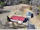 Aerial view showing a house with a red metal roof and a separate garage at 291 Patterson Farm Rd, Mooresville, NC 28115