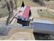 Aerial view of a single-story home with red metal roof and detached garage at 291 Patterson Farm Rd, Mooresville, NC 28115