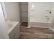 Bathroom with a tub/shower combo and gray vanity at 291 Patterson Farm Rd, Mooresville, NC 28115