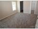 Spacious bedroom with gray carpeting and lots of natural light at 291 Patterson Farm Rd, Mooresville, NC 28115