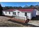 Single-story home with red metal roof and brick accents at 291 Patterson Farm Rd, Mooresville, NC 28115