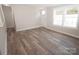 Bright living room with vinyl plank flooring and lots of natural light at 291 Patterson Farm Rd, Mooresville, NC 28115