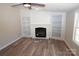 Living room featuring a fireplace and built-in shelving units at 291 Patterson Farm Rd, Mooresville, NC 28115