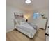 Charming bedroom with striped bedding and a white dresser at 301 W Hartford Ave, Bessemer City, NC 28016