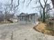 Newly renovated craftsman home with gray siding, front porch, and landscaping at 301 W Hartford Ave, Bessemer City, NC 28016