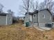 Exterior view of a gray house with steps and a small yard at 301 W Hartford Ave, Bessemer City, NC 28016