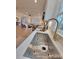 Modern kitchen sink with gold faucet and quartz countertops at 301 W Hartford Ave, Bessemer City, NC 28016