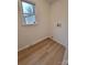 Bright laundry room features vinyl flooring and space for a washer and dryer at 301 W Hartford Ave, Bessemer City, NC 28016