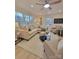 Light filled living room with L-shaped sofa, hardwood floors, and large windows at 301 W Hartford Ave, Bessemer City, NC 28016