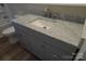 Modern grey bathroom vanity with marble countertop at 303 Patterson Farm Rd, Mooresville, NC 28115