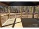 Covered patio with wooden deck and wooded views at 303 Patterson Farm Rd, Mooresville, NC 28115