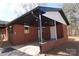 Covered patio with recessed lighting and brick walls at 303 Patterson Farm Rd, Mooresville, NC 28115