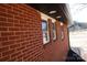 Brick exterior wall with three windows and dark brown accents at 303 Patterson Farm Rd, Mooresville, NC 28115