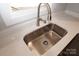 Stainless steel sink with modern faucet in kitchen at 303 Patterson Farm Rd, Mooresville, NC 28115